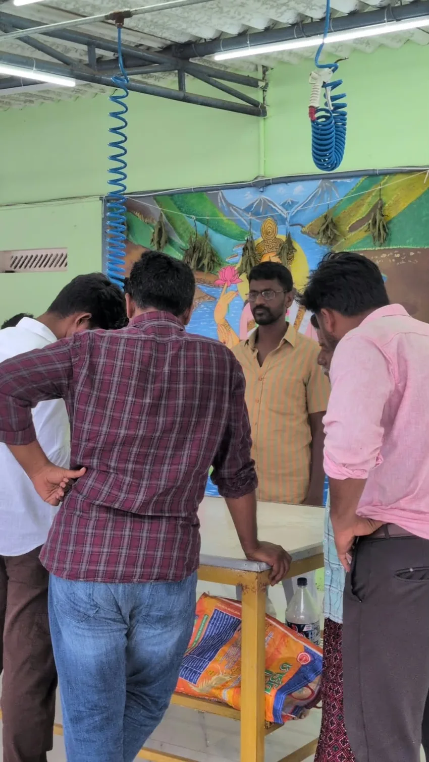 Farmers and the SSG team discussing a seed order